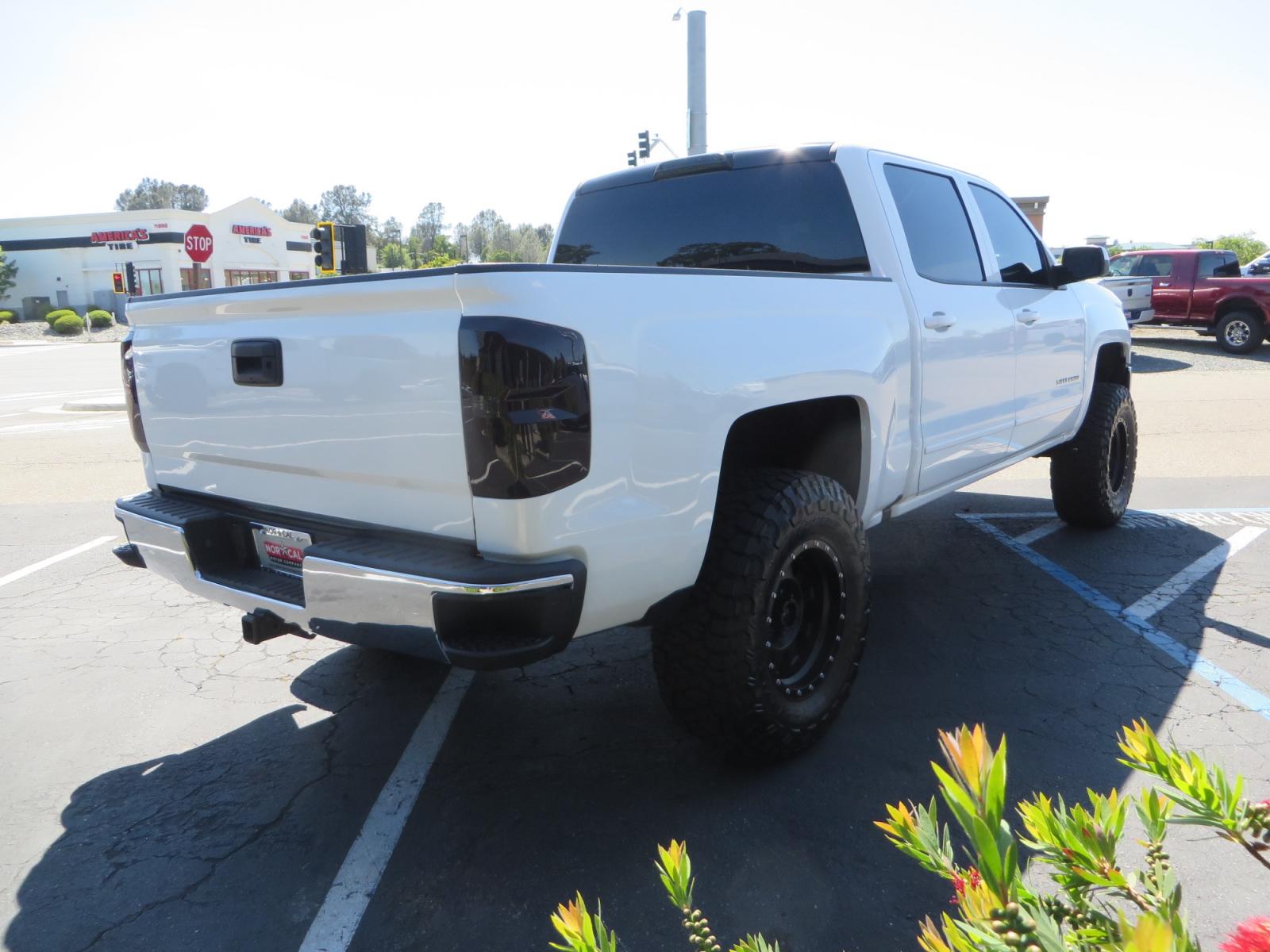 2018 White /BLACK Chevrolet Silverado 1500 LT (3GCPCREC7JG) with an 5.3L V8 OHV 16V engine, automatic transmission, located at 2630 Grass Valley Highway, Auburn, CA, 95603, (530) 508-5100, 38.937893, -121.095482 - Must see Pre Runner.... CST front lift spindals, Camburg UCA's, King Adjustable 2.5 Coil-overs, King 2.5 rear shocks, 35" Toyo RT Trail tires, 17" Method Race wheels, MZ front skid plate, G2 rear differntail cover, Full size bed mounted spare tire, Black Vinyl roof wrap, smoke tail lights and 3rd br - Photo #4